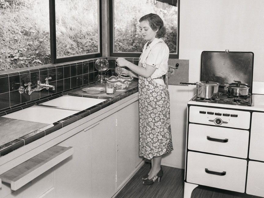 Person standing in a Franke kitchen in the 1940s